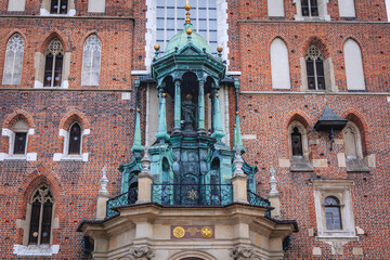 Fototapeta na wymiar Details of facade of St Mary Basilica in Old Town, historic part of Krakow city, Poland