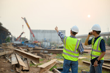 road construction engineer with civil engineer to supervise new road construction and inspect...