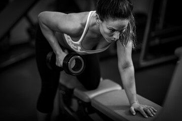 Fototapeta na wymiar Triceps strength exercise in a gym.