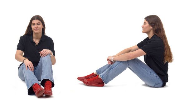 Front And Side View Same Young Girl Sitting On The Floor On White Background