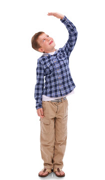 Isolated boy kid, check height and smile for growth, development and thinking by png background. Male child model, young and happy with hand for measuring, think and childhood wish with kids fashion