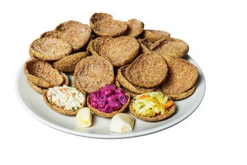 Rye bread toasts on a plate on a white background