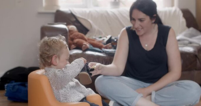 MS Mother feeding disabled son (18-23 months) at home