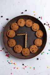 top distant view delicious chocolate cookies inside brown round plate on the white background cookie biscuit sweet tea