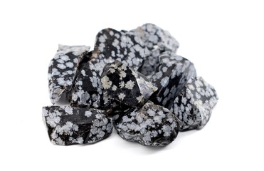 Raw snowflake obsidian semi precious stones on white background.