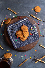 top view delicious chocolate cookies with candles on the dark-grey background cookie biscuit sweet sugar