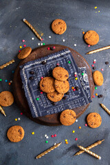 top view delicious chocolate cookies with candles on the dark-grey desk cookie biscuit sweet sugar