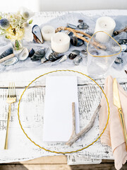 Festive wedding, birthday, party table setting with cutlery and plate. Menu mockup. Elegant modern restaurant menu template with vertical blank paper card. Mediterranean dinner menu design.