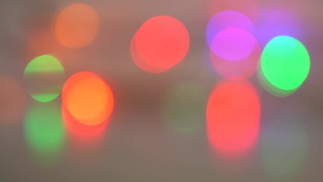 Abstract colorful Christmas holiday 4k video bokeh background. Defocused glowing bright multicolor led lights garland
