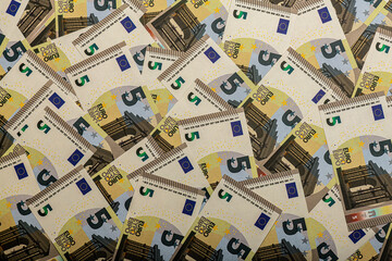 a heap of 5 euro banknotes