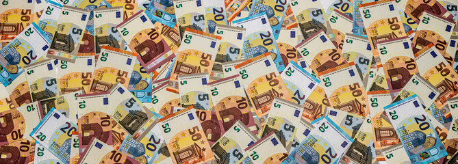 a heap of different euro banknotes for banner, panorama or border