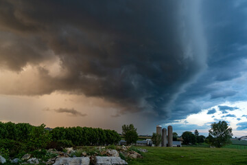 Fototapeta na wymiar Storm Clouds over Farm and Farmland