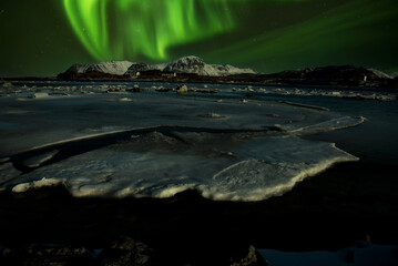 A beautiful green and red aurora dancing over , Iceland