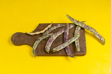 front view green fresh beans raw long plant beans on yellow background bean food color photo meal vegetable plant