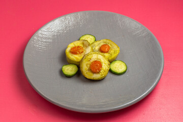 half-top view cooked squash slices inside grey plate with cucumbers on the pink desk food vegetable dinner dish color photo