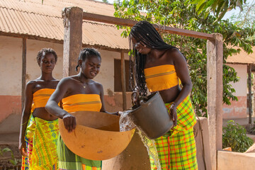 Group of black women near well