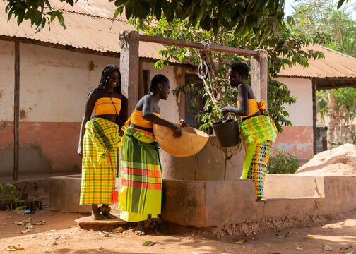 Group of black women near well