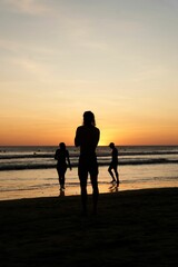 Group of friends enjoying a vibrant beach sunset