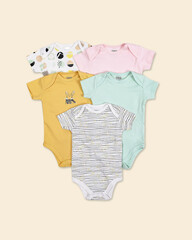 Set of baby, children clothes on pastel background