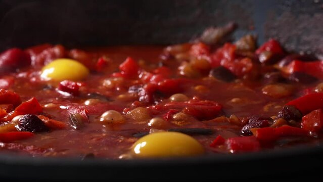 Shakshuka is cooked in a pan.