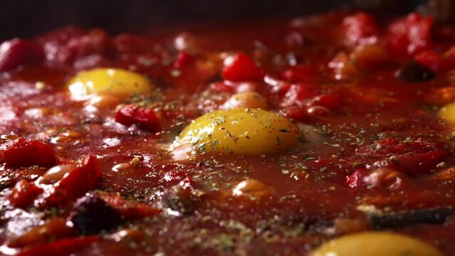 Shakshuka is cooked in a pan.