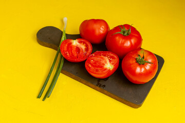top view fresh red tomatoes fresh and ripe vegetables with green onion on the yellow desk vegetable food ripe color fresh product ingredient