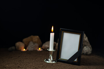 burning candle with empty picture frame on dark surface sci fi fantasy cosmic death