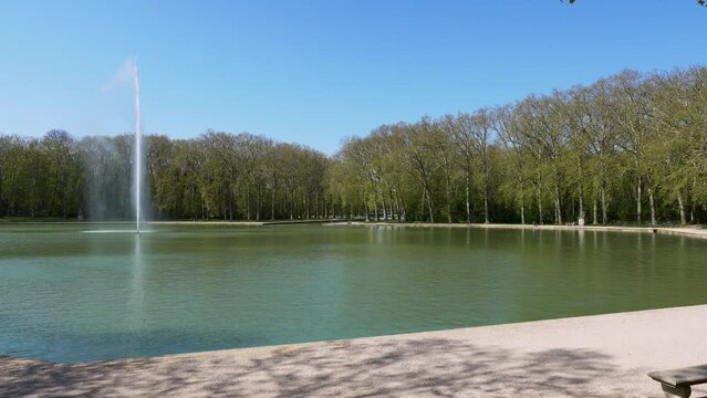 Pan over the Octogone Pool and fountain in Parc de Sceaux in summer - Hauts-de-Seine, France.