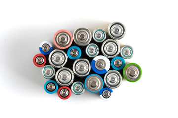 Lots different batteries white background.
