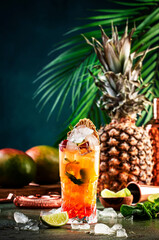 Alcoholic cocktail with vodka, pineapple juice, mango, liquor, ice. Long drink or summer mocktail....