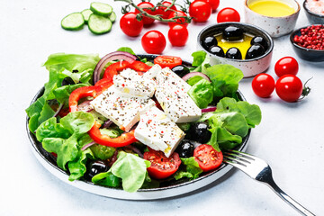 Greek salad with feta cheese, kalamata olives, cherry tomato, yellow paprika, cucumber and onion,...