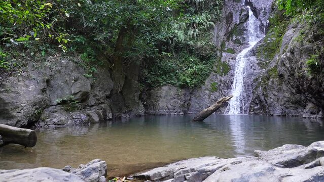 Scenic view of Kai Bae Waterfall surrounded by tropical trees, Koh Kood, Thailand