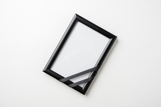 top view empty picture frame of deceased person on the white background death funeral