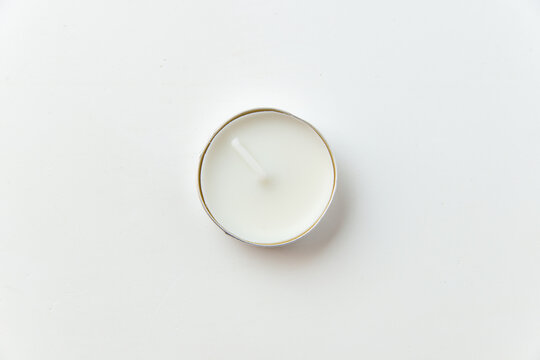 top view of round candle on the white background flame lamp fire