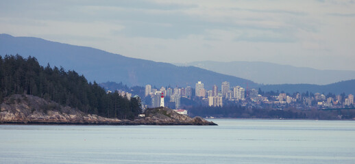 Lighthouse Park and City with Mountains in Background. Sunset. West Vancouver, British Columbia, Canada.