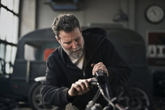 adult man works in his workshop