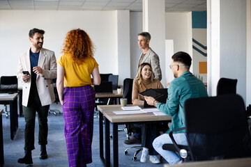 Happy team of environmentalists having a meeting at casual office.