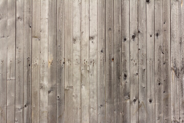 Old wooden background darkened by time.