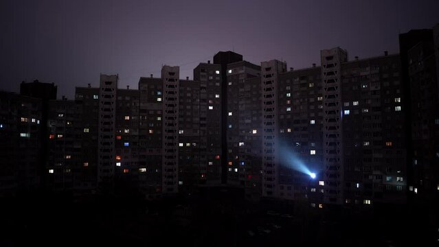 Timelapse of high rise apartment buildings during a war time rolling blackout in Kyiv, Ukraine. Could illustrate an economic or global energy crisis.