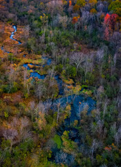 River snaking trough the trees during sunset, drone image, Wisconsin
