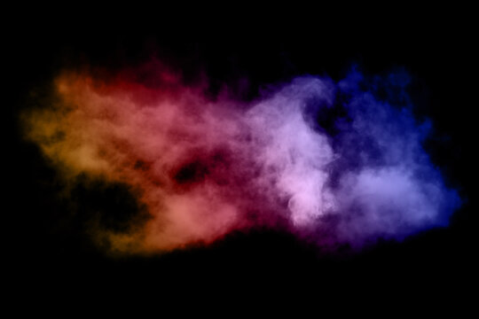 Blue, pink, purple vape smoke on black isolated background.