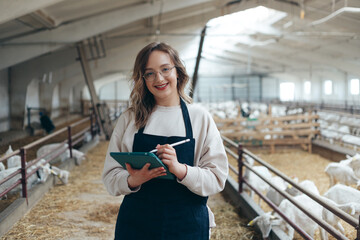 Vet doctor making notes in card about animals