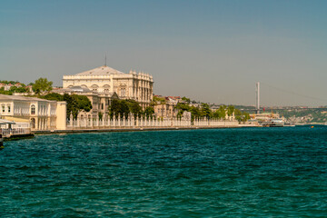 Fototapeta na wymiar Dolme Bahce palace om the sea with the bosphorus bridge in the background