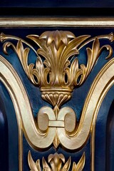 Closeup of the golden ornamental decoration on a blue wall