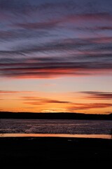 Stunning sunset captures the beauty of the horizon, with the sun slowly disappearing in the sky