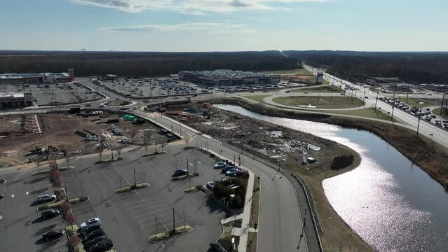 Drone view over highways by parking lots and industrial areas in North Brunswick New Jersey