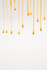 Vertical view of orange stripes and waves on white isolated background