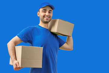 Delivery man with a box. Courier in uniform cap and t-shirt service fast delivering orders. Young...