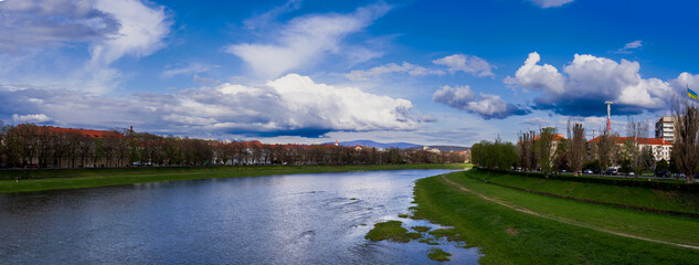 beautiful clouds over the river. embracing clouds , panorama of the river in the city