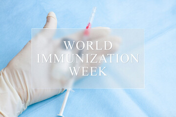 World Immunization Week medical concept. Nurse's hand with vaccine and syringe. Text in the frame...